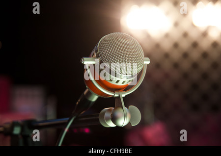 Closeup of audio microphone on stage background Stock Photo