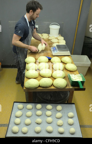 An artisan baker producing bread and buns Stock Photo - Alamy