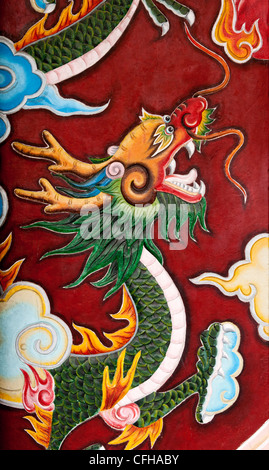 Painted dragon on an entrance door to the Quan Cong Pagoda, also known as the Chua Ong Temple, Tran Phu St. Hoi An, Viet Nam Stock Photo