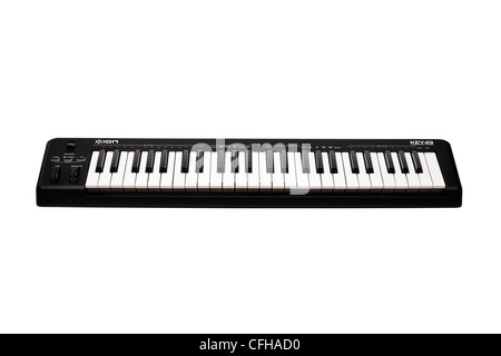 Musical keyboard instrument, cut out on white background Stock Photo