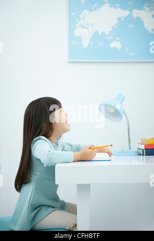 preschooler child girl with book over her head Stock Photo - Alamy