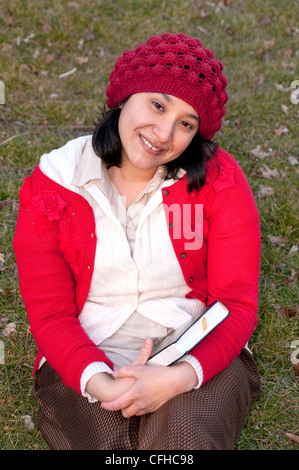 Hispanic woman in park. Stock Photo