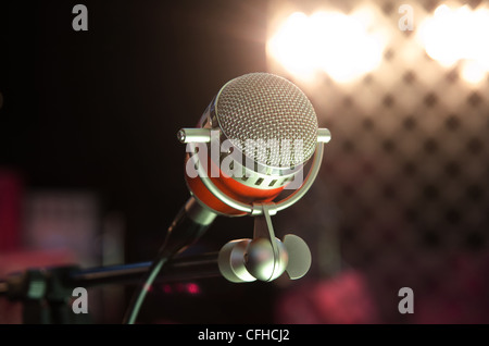 Closeup of audio microphone on stage background Stock Photo