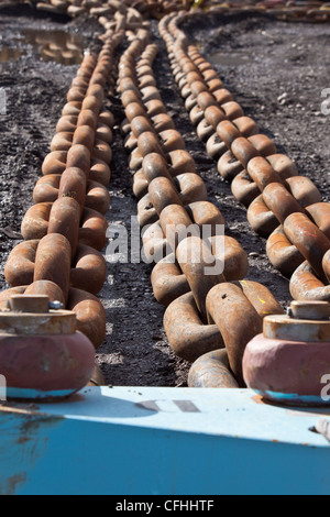 Mooring and Anchoring chains used in oil exploration marine industry Stock Photo