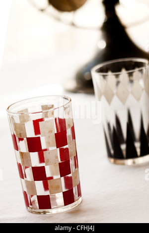 Vintage, mid-century modern drinking glasses in backgammon and checkerboard pattern Stock Photo