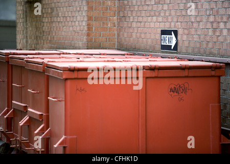 Dumpsters behind building Stock Photo