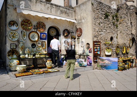 Tourist shop in Piazza Duomo sell brightly coloured ceramic works, art, religious items and much more. Piazza Duomo, Ravello, Stock Photo