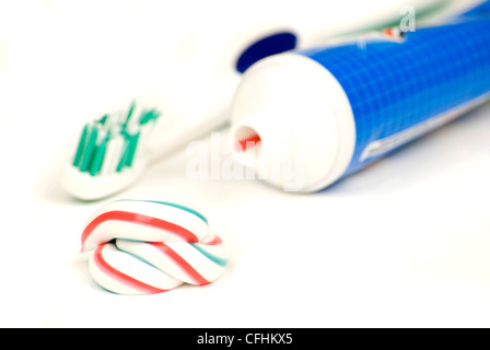 white red and blue squeezed toothpaste isolated on a white background Stock Photo