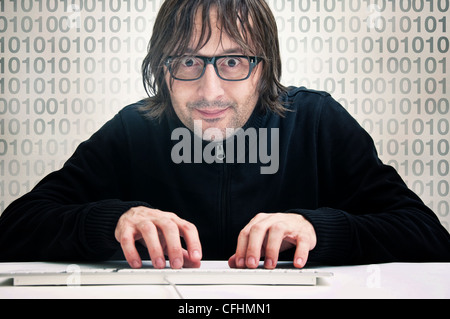 Man is typing on computer keyboard, computer hacker concept Stock Photo