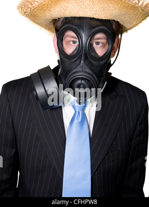 Picture of a man in suit with a gasmask and a hat Stock Photo