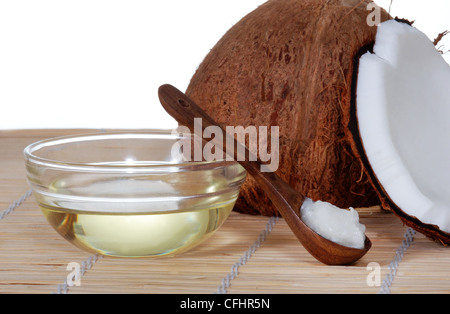 Coconut oil on a bamboo mat Stock Photo