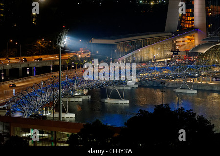 The Helix bridge from above, joining Marina Bay Sands and the Esplanade promenade in Singapore, at night Stock Photo