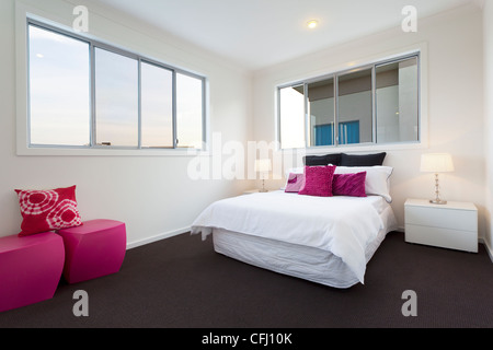 Modern bedroom with double bed Stock Photo