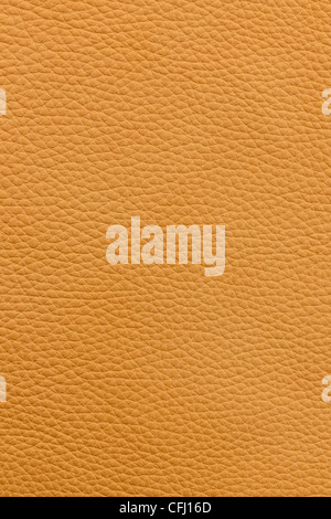 Yellow or light brown natural leather background or texture close up Stock Photo