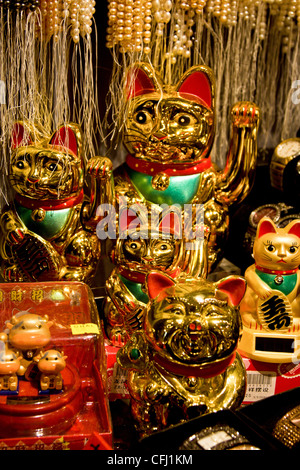 Plastic fantastic Gold lucky waving cats in Hong Kong Stock Photo