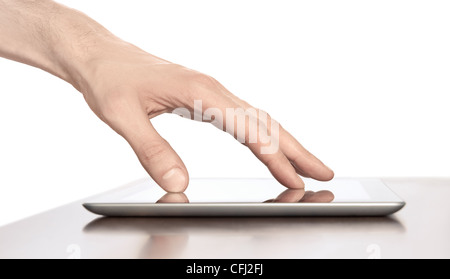 Man hand touching screen on modern digital tablet pc. Close-up image with shallow depth of field focus on finger. Stock Photo