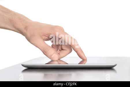 Man hand touching screen on modern digital tablet pc. Close-up image with shallow depth of field focus on finger. Stock Photo