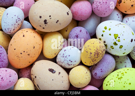 Still life photo of lots of colourful speckled candy covered chocolate easter eggs