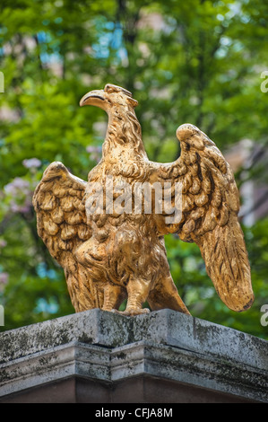 Golden statue of Eagle, ornate gate post, side entrance of The Ritz Hotel, 22 Arlington Street off Piccadilly, London, England Stock Photo