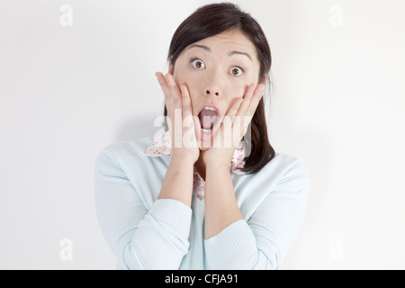 Surprised young woman Stock Photo