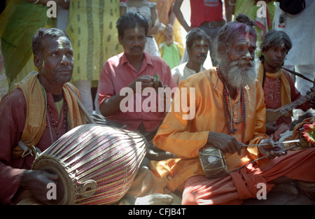 Baul musicians at the celebration of Holi festival (colors festival or spring festival) in Santiniketan, India. Stock Photo