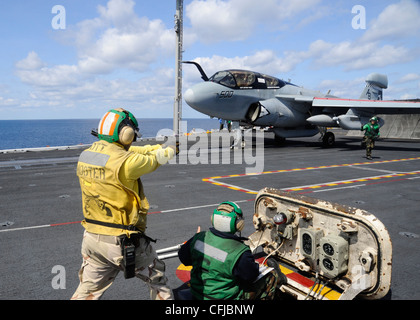 Sailors launch an EA-6B Prowler assigned to the Rooks of Electronic Attack Squadron (VAQ) 137 from the aircraft carrier USS Enterprise (CVN 65). Enterprise is deployed as part of the Enterprise Carrier Strike Group to support maritime security operations and theater security cooperation efforts in the U.S. 5th and 6th Fleet areas of responsibility. Stock Photo