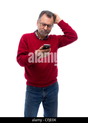 Confused mature man using iPhone Stock Photo