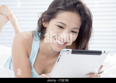 Young woman using tablet PC Stock Photo