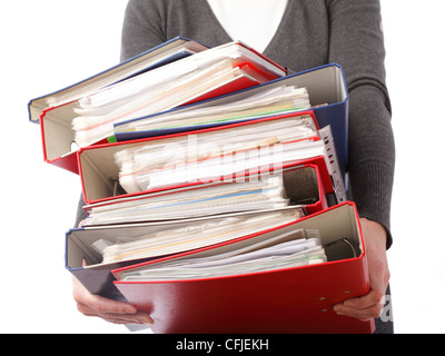 woman in grey holding stack of folders Pile with old documents and bills. Isolated on white background Stock Photo