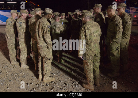 Members of the 45th Infantry Brigade, Oklahoma Army National Guard receive a pre-departure briefing at Camp Shelby, Miss., before boarding busses for the 14-hour ride to Oklahoma City. The 45th has been mobilized in support of Operation Enduring Freedom for a year. More than 2,200 Oklahoma Guardsmen spent about eight months in Afghanistan and another 800 spent the same time in Kuwait. Stock Photo