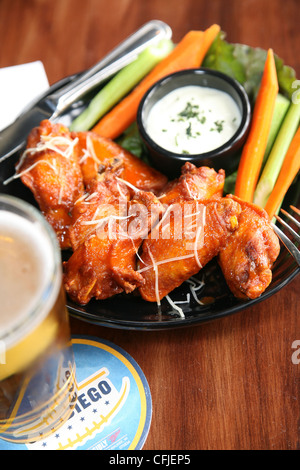 Spicy buffalo wings with bleu cheese dipping sauce Stock Photo