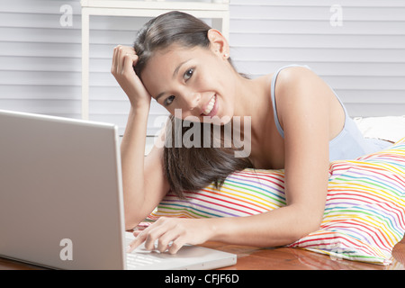 Young woman using a laptop Stock Photo