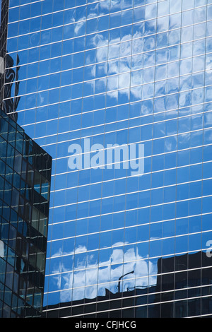 Reflections in glass building Stock Photo