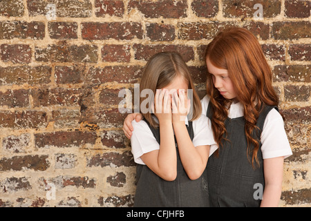 Girl comforting her friend Stock Photo