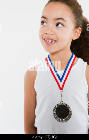 Girl wearing a medal Stock Photo