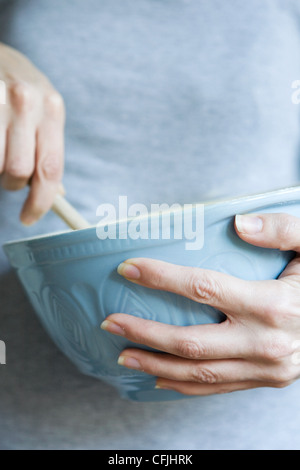 Woman with mixing bowl Stock Photo