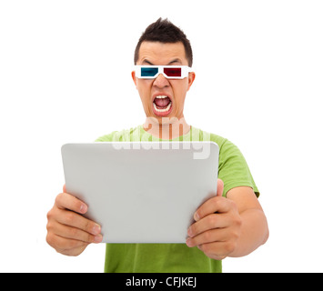 Surprised Young man in 3D glasses and watching the tablet pc Stock Photo
