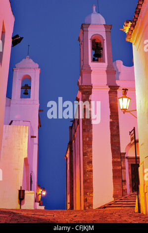 Portugal, Alentejo: Nocturnal view to the parish church and community building at the center of historic village of Monsaraz Stock Photo