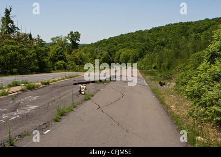 Closed section of PA Route 61 near Centralia warped and with fissures due to underground coal mine fire. Stock Photo