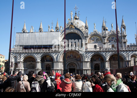 Groups of carnival revelers on St Marks Square Venice Italy Stock Photo