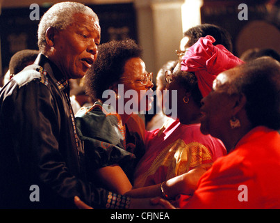 President Nelson Mandela and Graca Machel greeting people at the Father Trevor Huddlestone memorial at St Mary's Cathedral in J Stock Photo