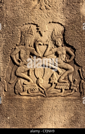 Two Apsaras dancing on lotus flowers, Bayon temple, Angkor Thom, Siem Reap, Cambodia Stock Photo