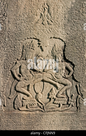 Two Apsaras dancing on lotus flowers, Bayon temple, Angkor Thom, Siem Reap, Cambodia Stock Photo