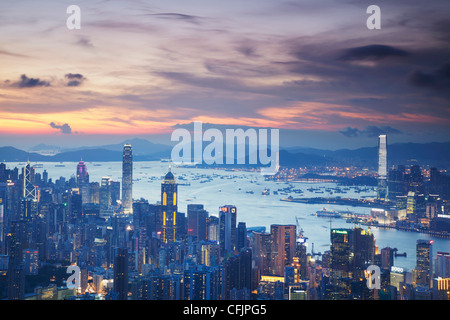 Hong Kong Island and Kowloon skylines at sunset, Hong Kong, China, Asia Stock Photo