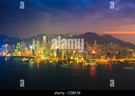 High view of the Hong Kong Island skyline and harbour at sunset, Hong Kong, China, Asia