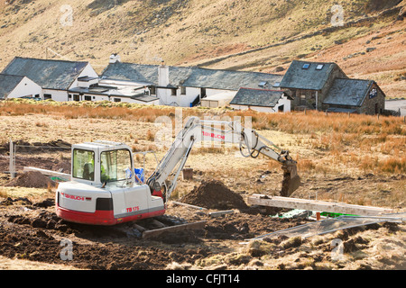 Work starts on the initial groundworks for 3 wind turbines to be constructed behind the kirkstone Pass Inn Stock Photo