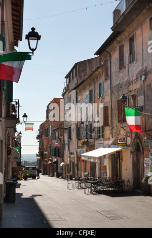 Corso Garibaldi in Ariccia with empty street restaurant and Italian Flags Stock Photo