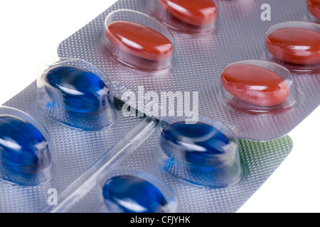 Red and blue tablets close up Stock Photo