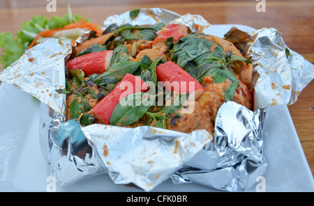 Ho Mok Thale is Thai food steamed seafood custard , curry seafood mixed herb Stock Photo