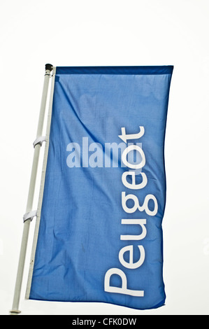 A Peugeot car dealership flag Stock Photo